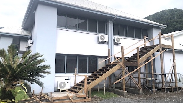 wooden stairway being built onto District Court building