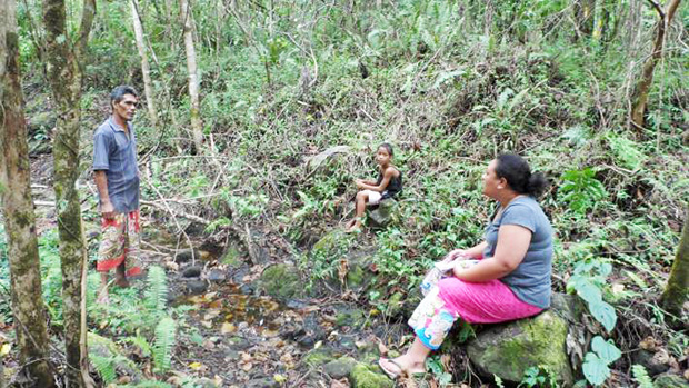 Dr Anita Latai-Niusulu interviewing a Samoan farmer at his plantation