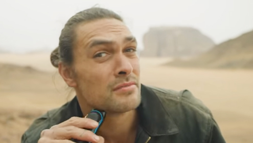 Jason Momoa shaving his beard.