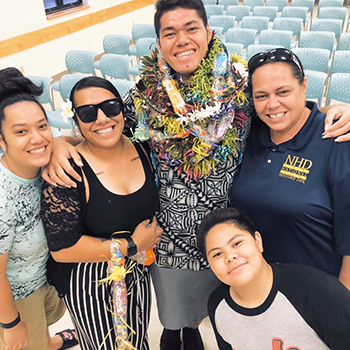 June Ifopo on graduation day with family