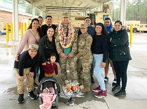 SSG Auelua with family after his promotion ceremony