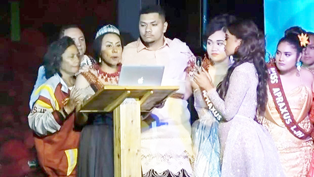 Kalo Funganitao during her speech surrounded by supporters