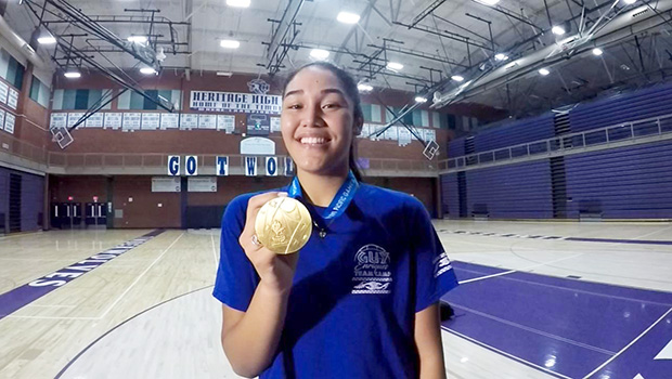 Heritage High School Timberwolves, junior Katie Peneueta with her gold medal.