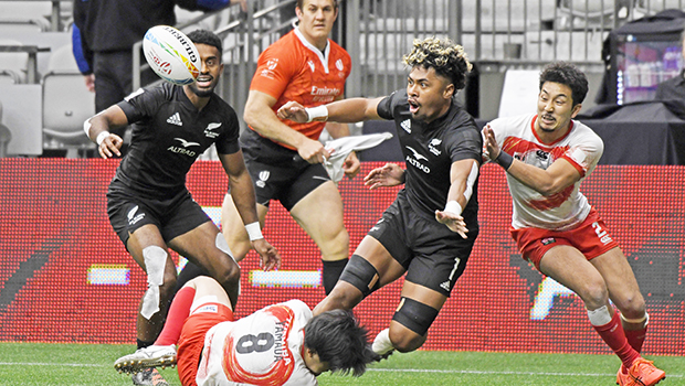 New Zealand's Kitiona Vai offloads the ball 