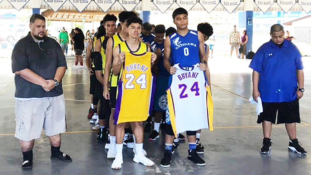 ASHSAA basketball players honoring Kobe Bryant