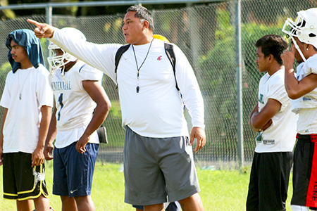 Leone Lions Head Coach, Okland Salave'a directing their strategic passing game during practice, at their school field this summer – in preparation for their game against the Vikes this Saturday. [photo: TG]
