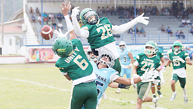 Two Leone Lions bat down the ball