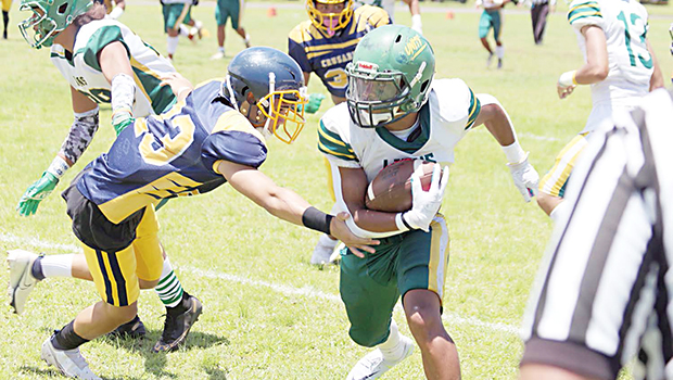 Ilalio Sefika trying to shake off a Marist defender