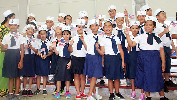 Manumalo Academy students dressesd up in sailor suits