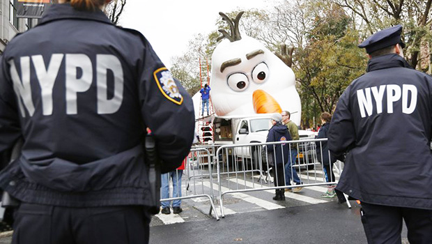 Police standing watch a day before the Thanksgiving Day parade