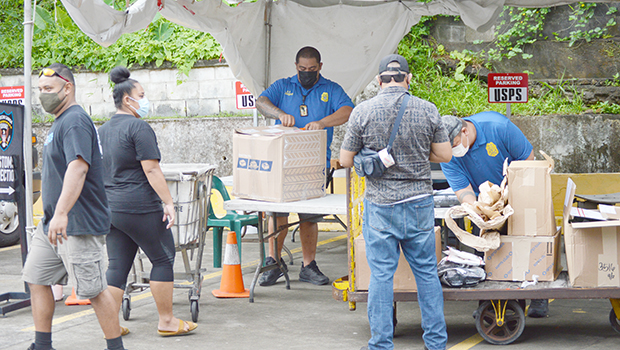Customs agent inspecting a packages
