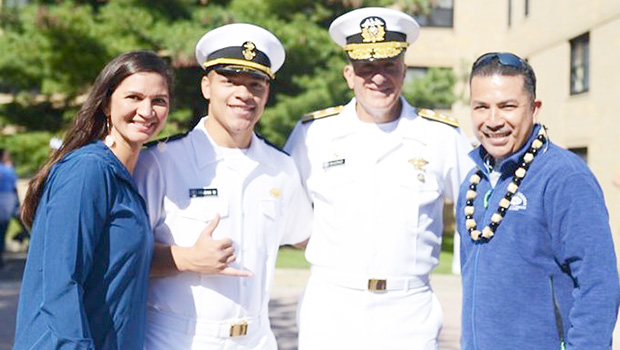 Manaia is pictured with his parents, Manaia and Laurie, and Rear Admiral Buono