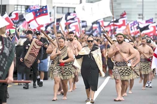 Indigenous Māori people walk through the streets of Wellington,