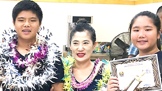 The Lo siblings — Michelle and Kevin — with local math instructor/ tutor Mrs. Seongshim Park 