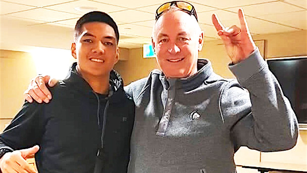 Samoana High School's Darius McMoore with Colorado State University, Pueblo head football coach John Wristen