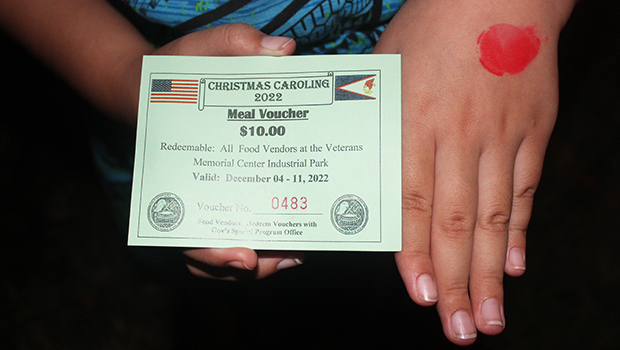 young girl with meal ticket