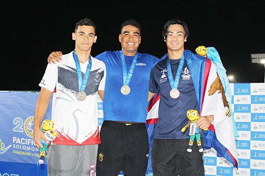 Micah Masei with Tasi Limtiaco of the Federated States of Micronesia (center) and silver medalist Alexandre Gane of New Caledonia