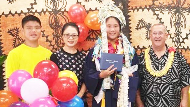Michelle is pictured with her brother Kevin, their mother Kelly, and PHS principal Mr. Willis