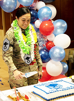 Chief Master Sergeant Jacinta Migo cutting her cake