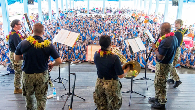 NAVY BAND MEMBERS PERFORMING FOR STUDENTS IN SAMOA