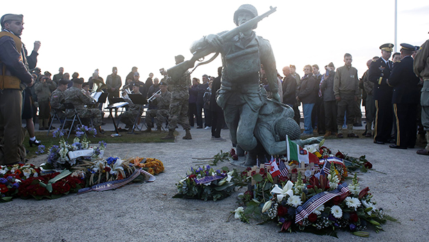 Floral tributes are placed at the National Guard Monument Memorial