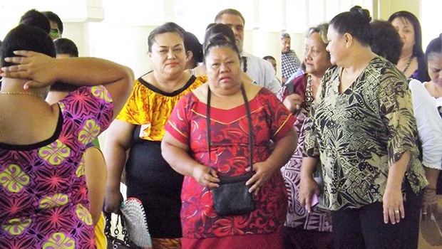  Luse Emo Tauvale (center wearing the red puletasi) leaves the courthouse in Apia last year