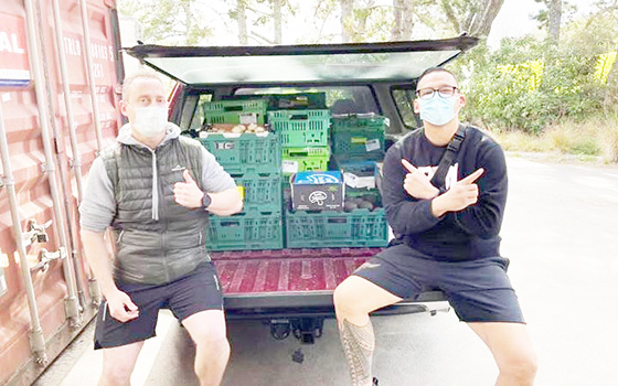 David Letele, right, and his food bank workers 