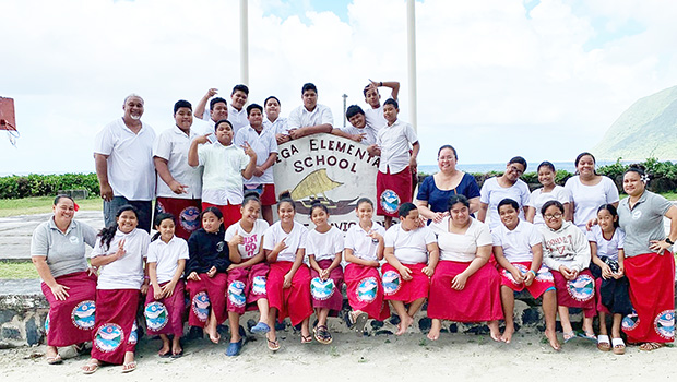 ASDHS personnel and students and staff at Olosega Elementary school