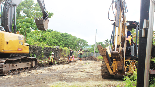 Workmen in Ottoville laying pipelines
