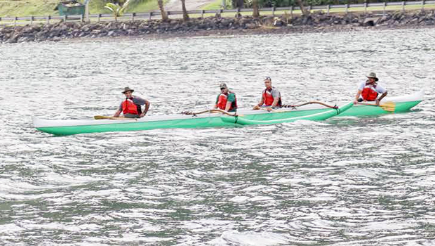 Paddlers in an outrigger canoe
