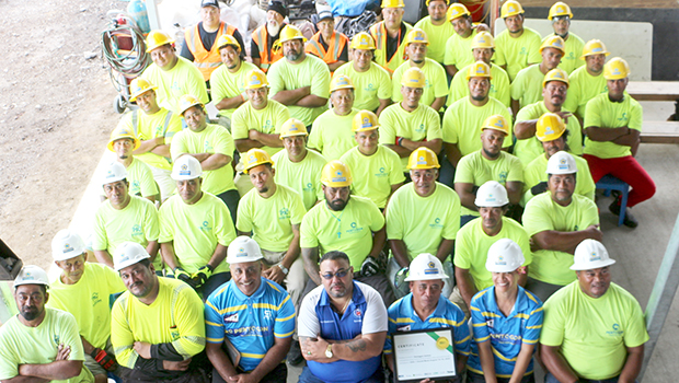 Taupau Tauileave Toluono with the construction staff