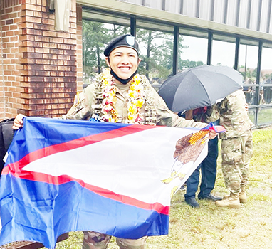 PFC Castro with American Samoa flag
