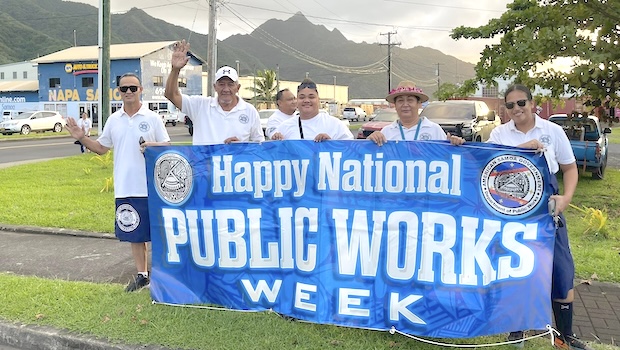 Dept. of Public Works staffers waving