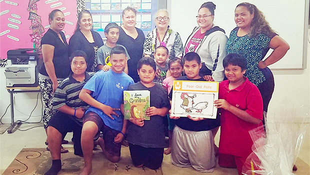 People participating in Lupelele Elementary’s Read Aloud program 