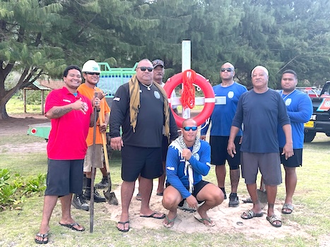 Marine Patrol Chief Ina Ulberg before a ring buoy with others