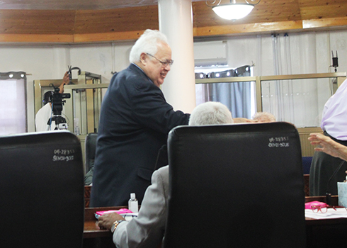 Deputy AG Roy Hall shaking hands 