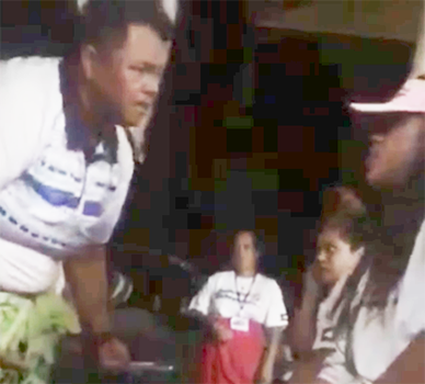 This photo is a screenshot from the video, showing head coach Annie Coffin - who is also a DPS police officer - addressing one of her players, only seconds before she allegedly put her hands on her.