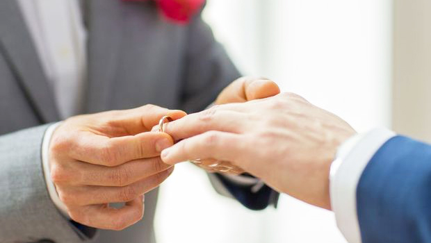 Photo of men's hands with wedding rings
