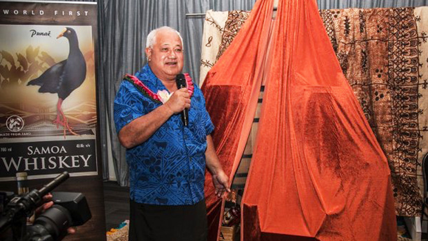   The Minister of Agriculture and Fisheries, Lopaoo Natanielu Mua introducing the new whiskey product