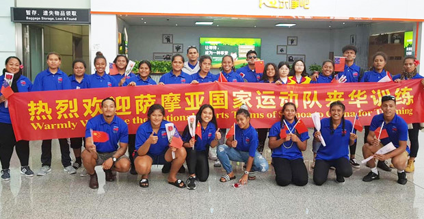 Samoa athletes in a photo with Chinese coaches