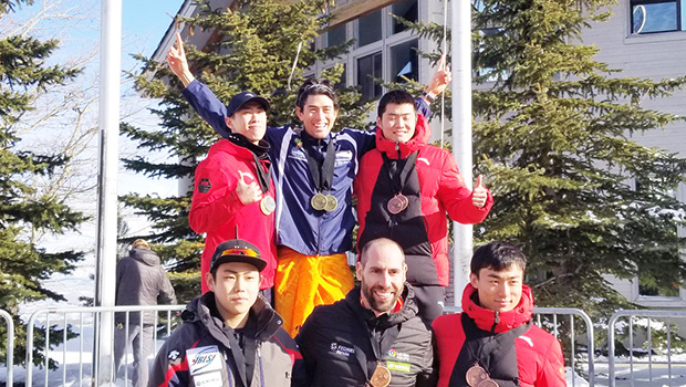Nathan Crumpton top center in an ie lavalava with his medals