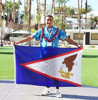 Bainivalu Davetawalu with Am Samoa flag