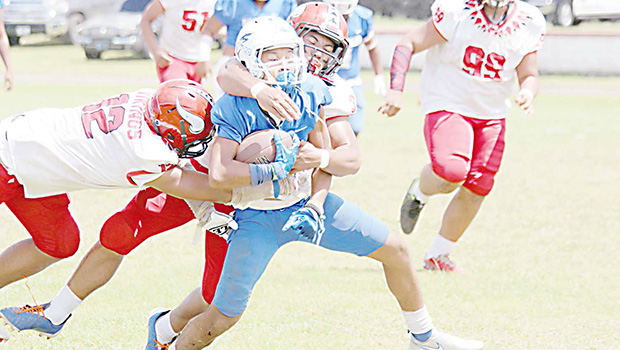 Samoana Sharks ball carrier is brought down near mid field by Joseph Umu (3)