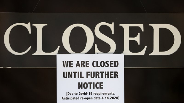 a notice of closure is posted at The Great Frame Up in Grosse Pointe Woods, Mich.