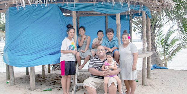 Perelini Ulugia with his children, neices and nephews in his growing beach fale business, Jaymy's