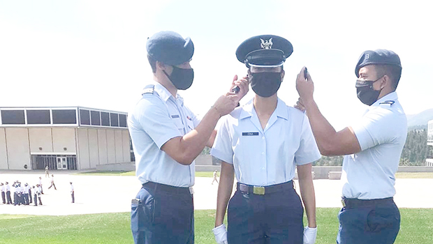 Serenalia May Iona (middle) receiving her sholder boards.