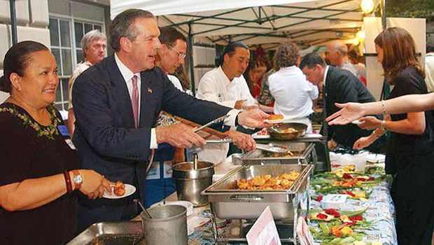 Serving Blue Marlin Tempura at the Western Pacific Regional Fishery Management Council's booth during the 2003 NOAA Fish Fry are (l-r) Council Executive Director Kitty Simonds, Secretary of Commerce Donald Evens, NOAA Administrator Conrad C. Lautenbacher and Honolulu Chef Russel Siu.