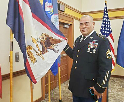  SFC Samasoni Lele’a with the American Samoa flag