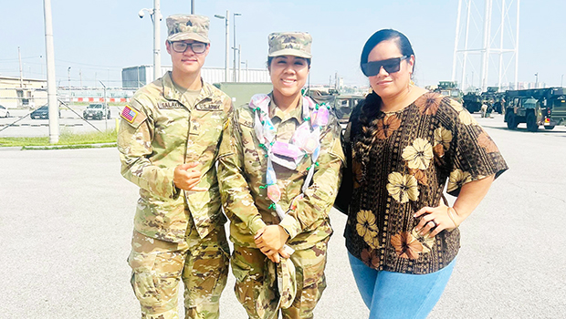 GT Andrea Faaleiua Asuao with two others