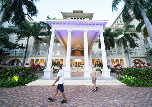 People maintaining social distancing on Thursday in front of the Moana Surfrider Hotel in Waikiki